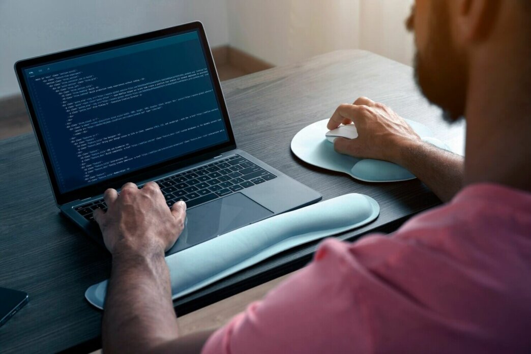 man working on laptop. He is part of WordPress Outsourcing to scale your business