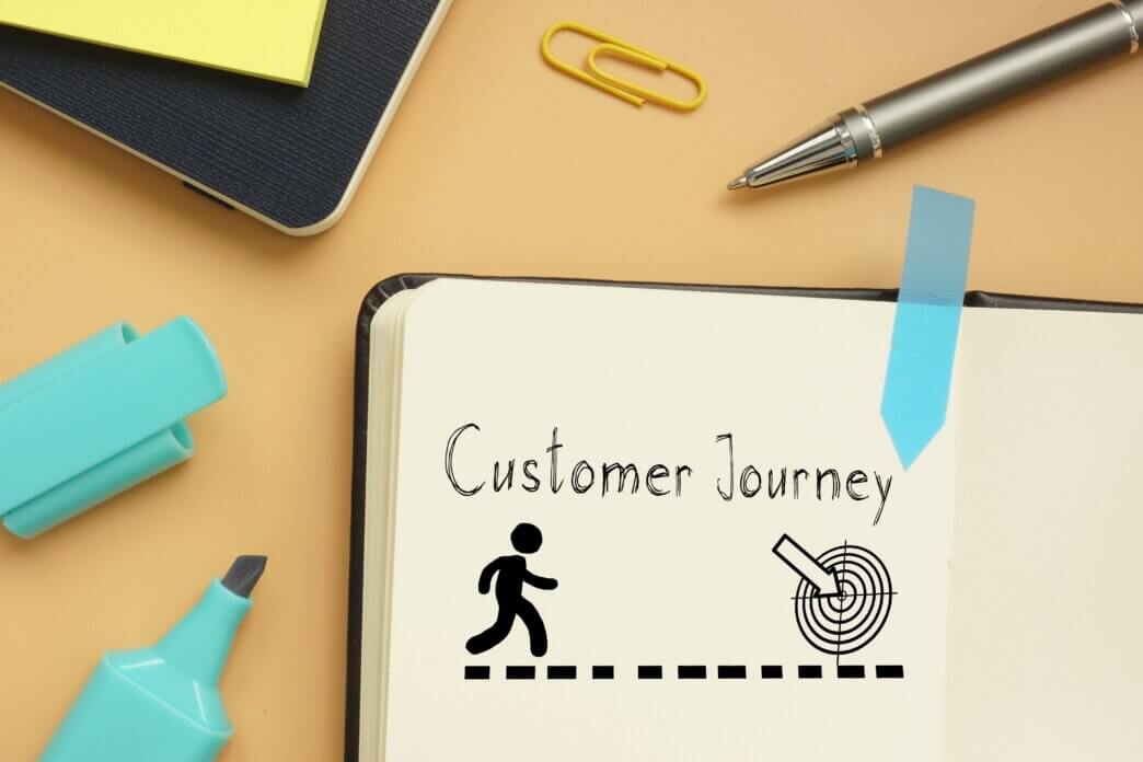 A notebook with what website audits reveal about customer journey and potential target