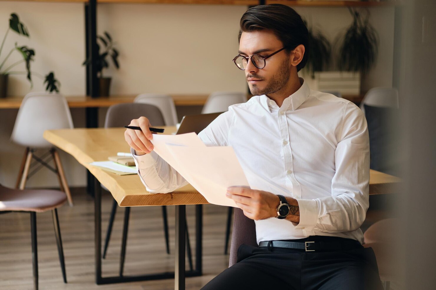 Business man assessing previous white label agency work
