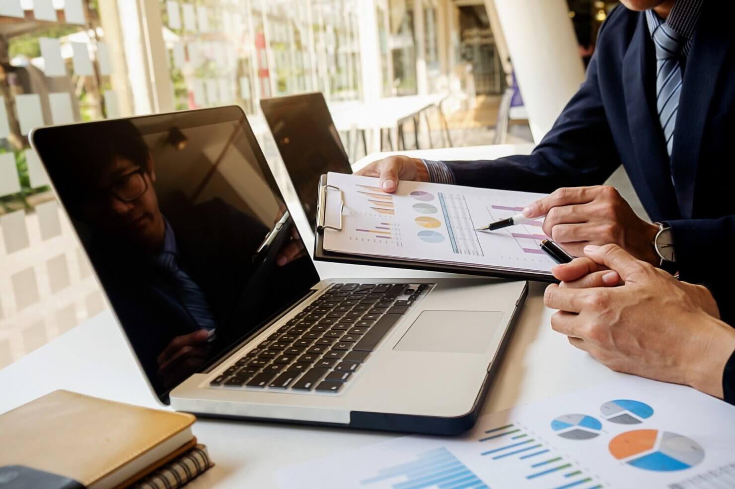 Business people analyzing the results of the audit your e commerce product pages