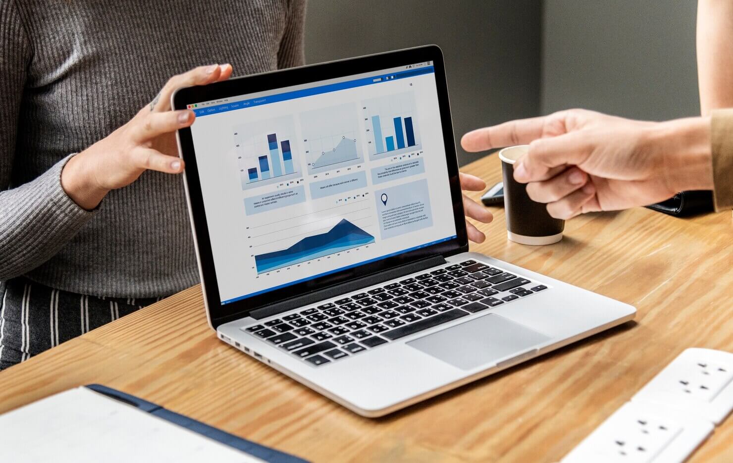 Business presentation on a laptop screen of automated vs manual website audits