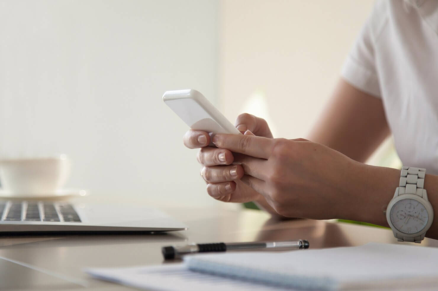 Businesswoman looking on phone dApps built on WordPress