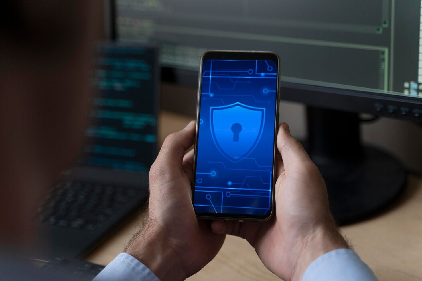 Close up hands holding smartphone with security lock on it. 