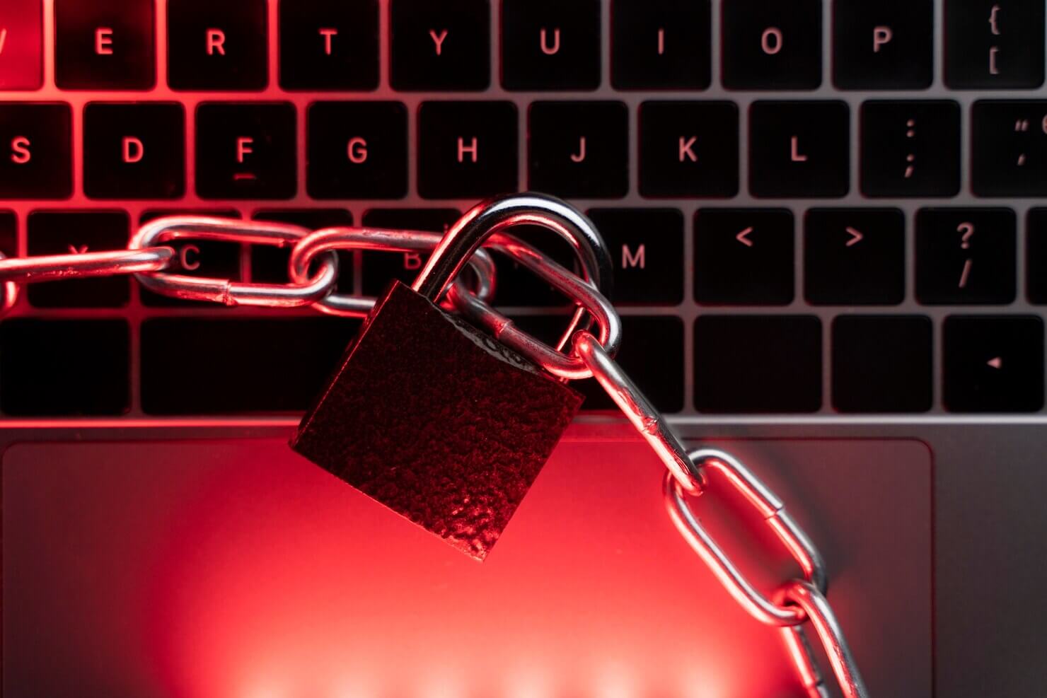 Close up laptop with lock and chain. Access denied to hackers and suspicious users