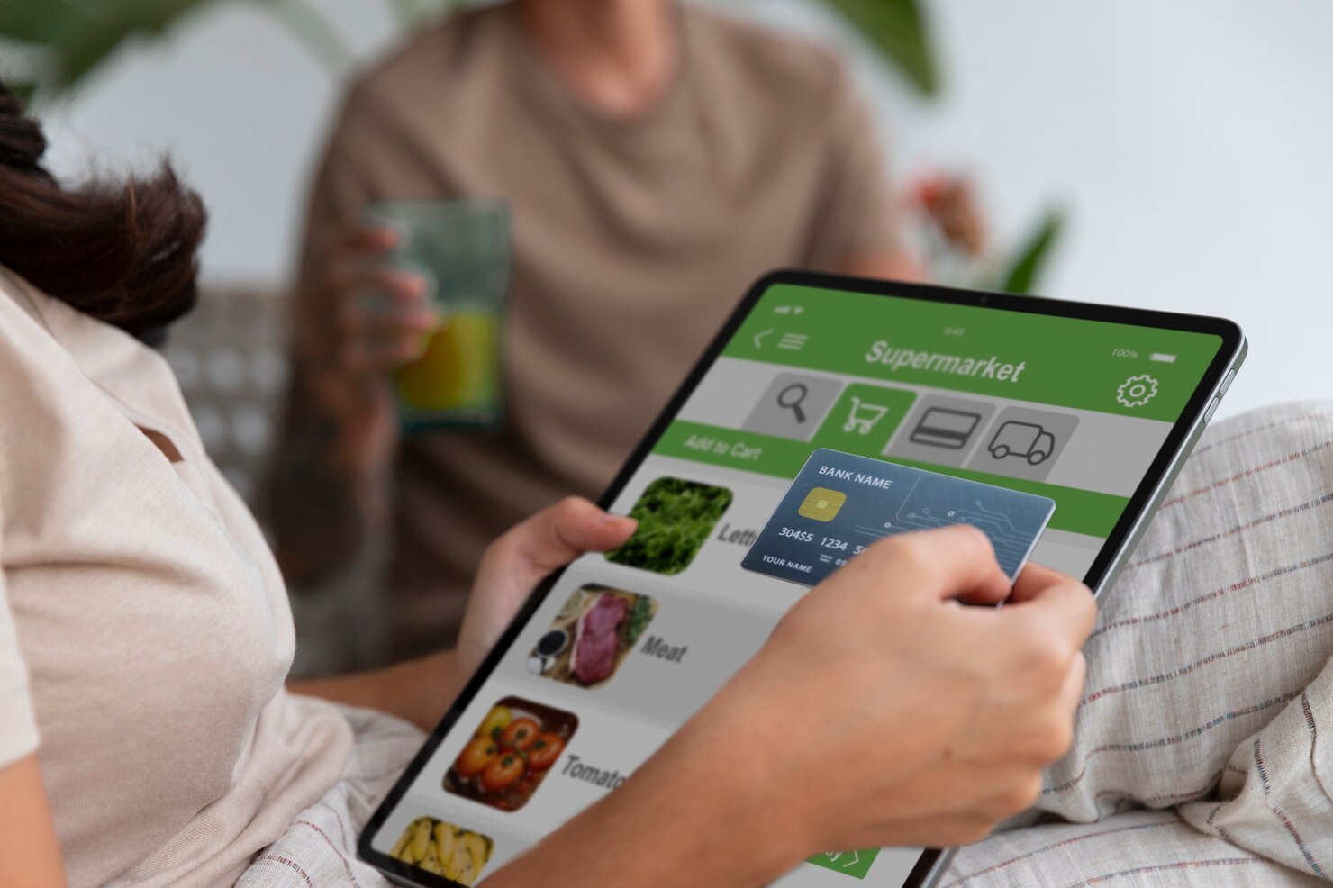 Close up on person doing online shopping. The person is looking through product recommendations to add to her cart