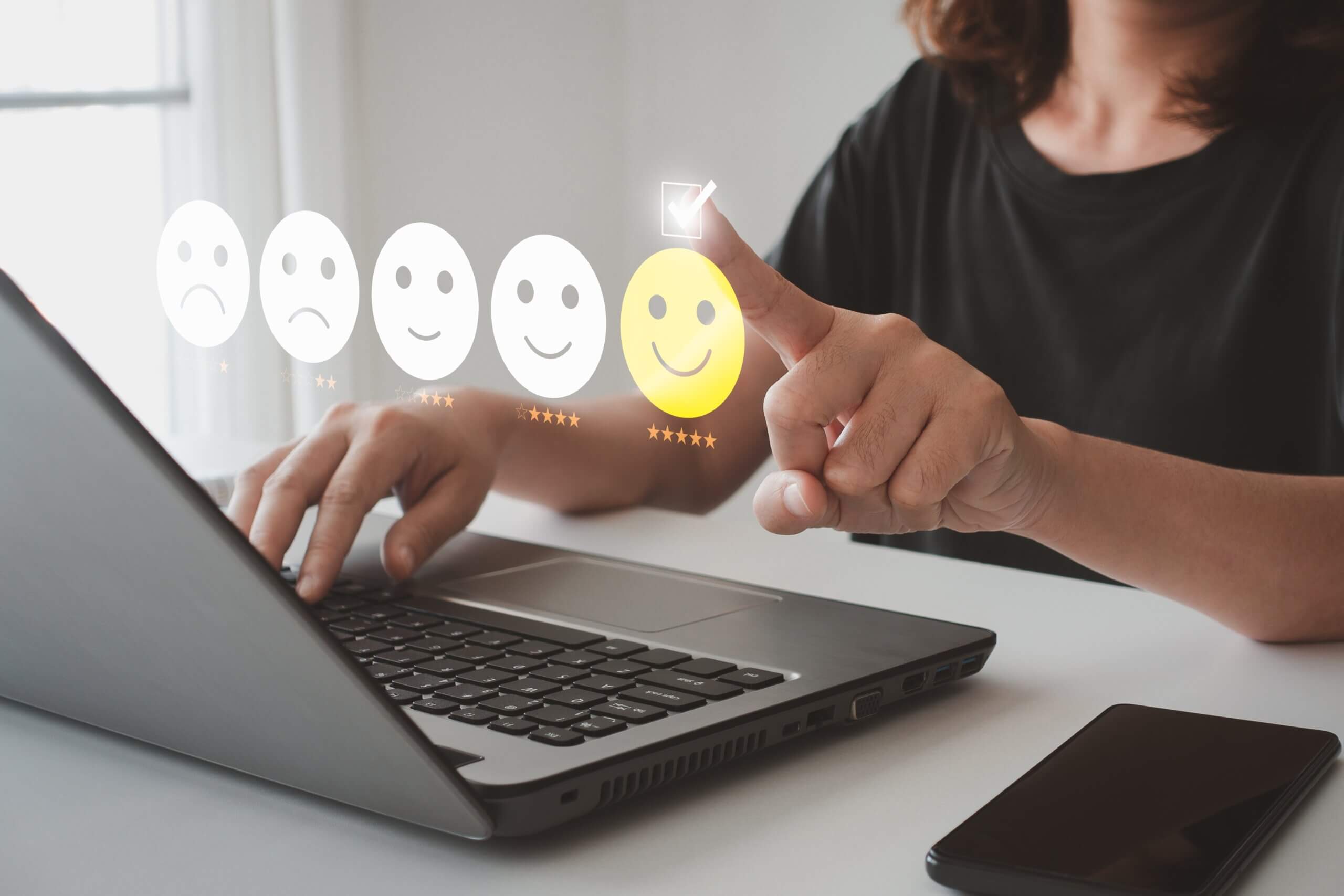 Create social proof with ratings. Woman clicking on happy face as she is happy with a business websites