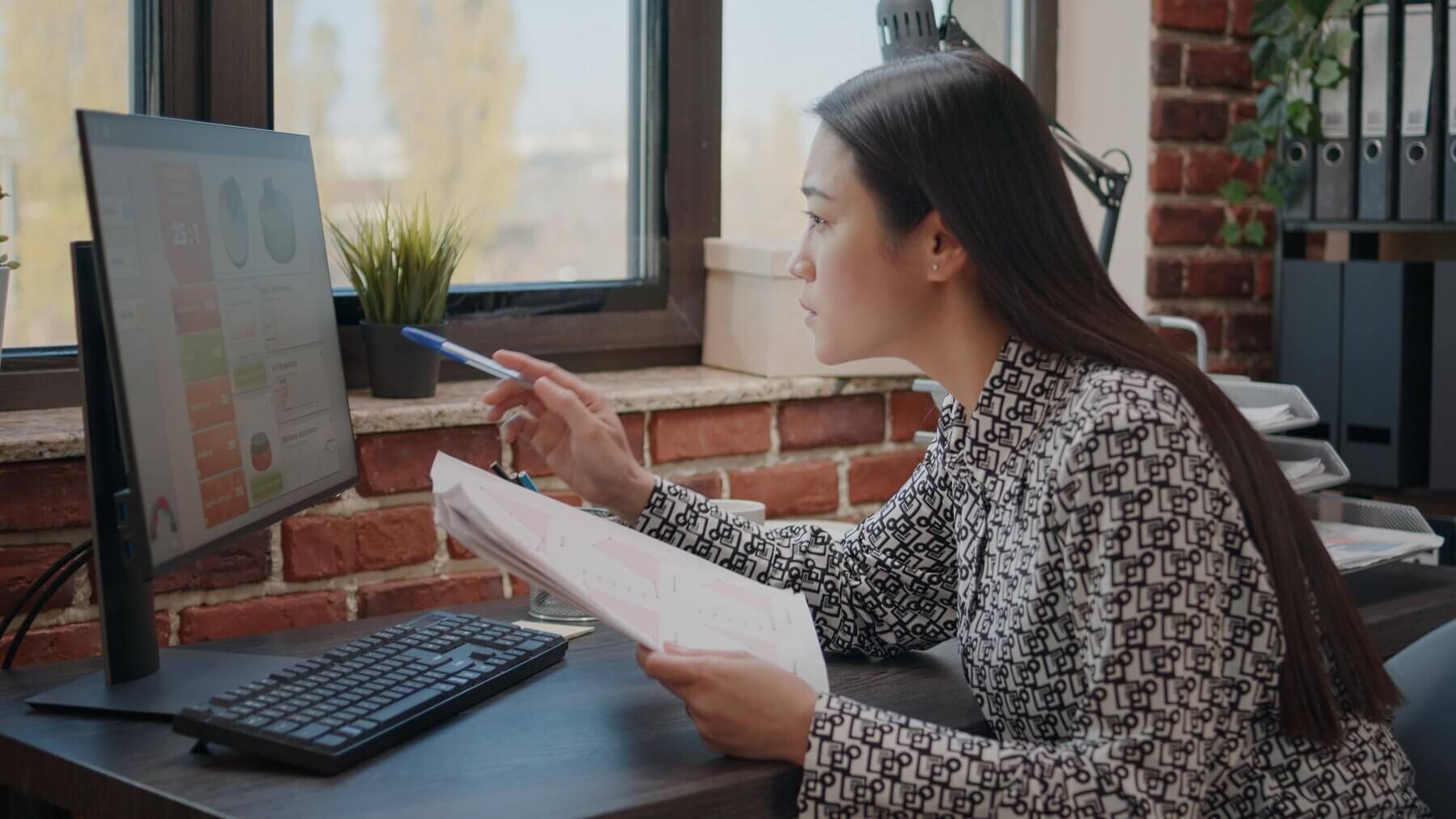 Female developer actively monitoring WooCommerce site to make sure that its running smoothly