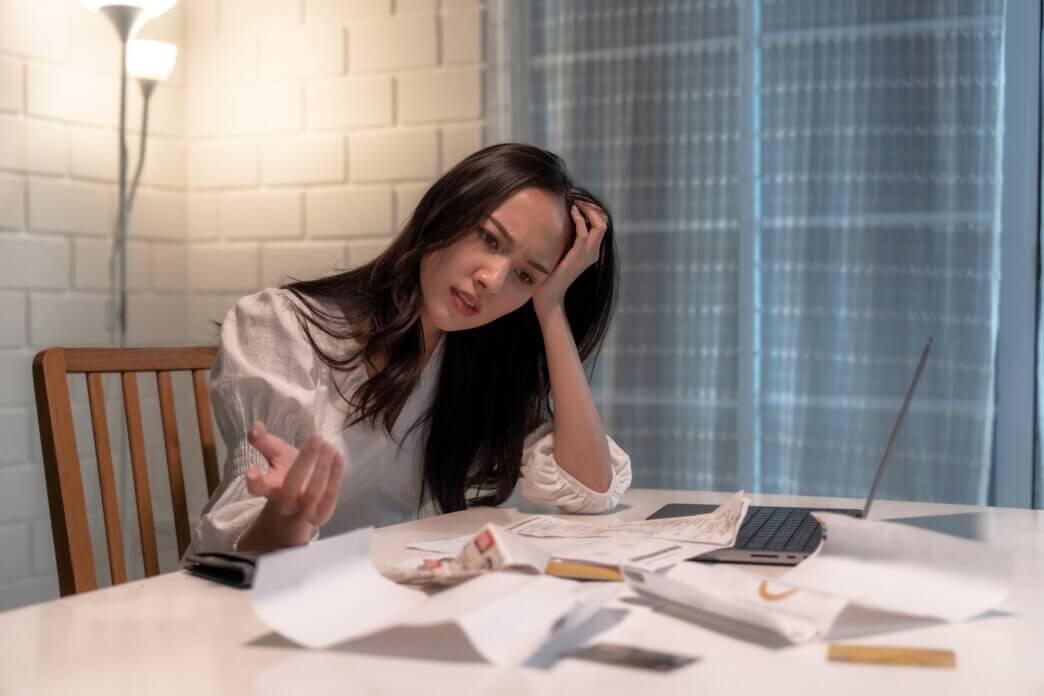 Female stressed out by the hidden costs of ignoring regular website audits