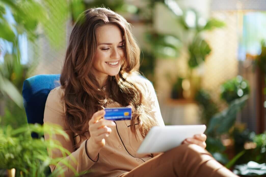 Female using tablet to test out checkout process accessible in WooCommerce