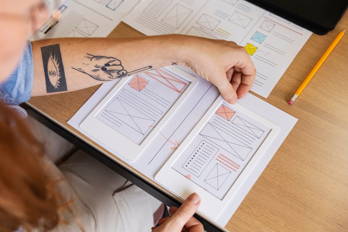 Female web designer taking notes in the office about how to personalize user experience
