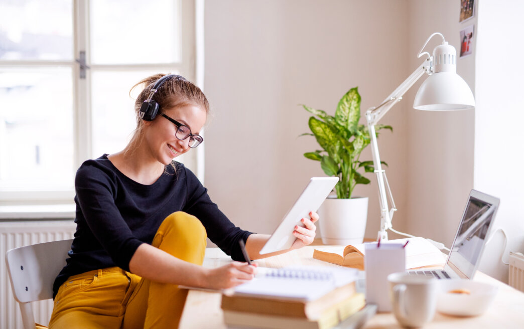 Girl working an online course via WordPress for educational websites