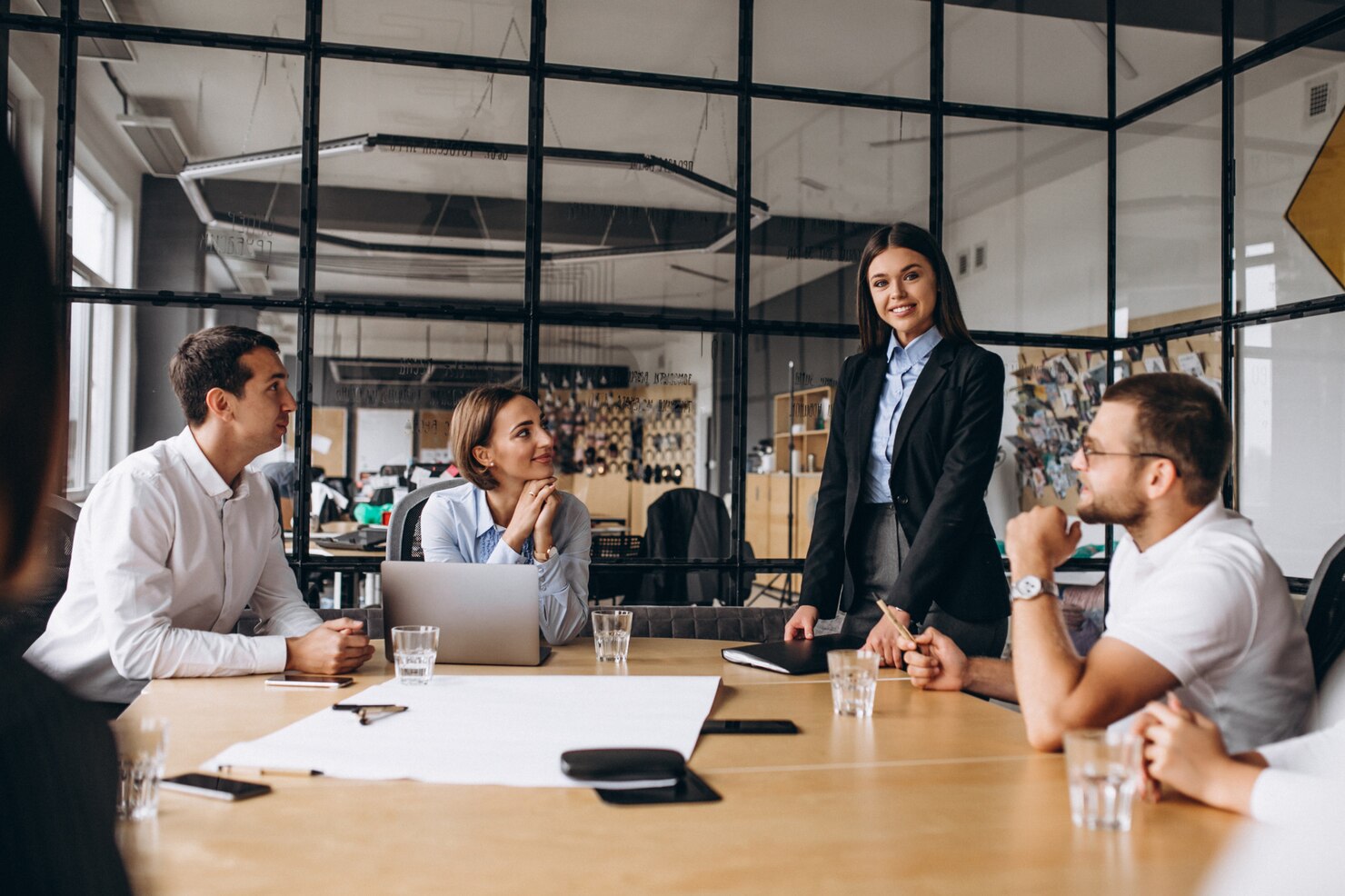 Group of people working out business plan in an office. Company deciding which white-label WordPress development solution to use