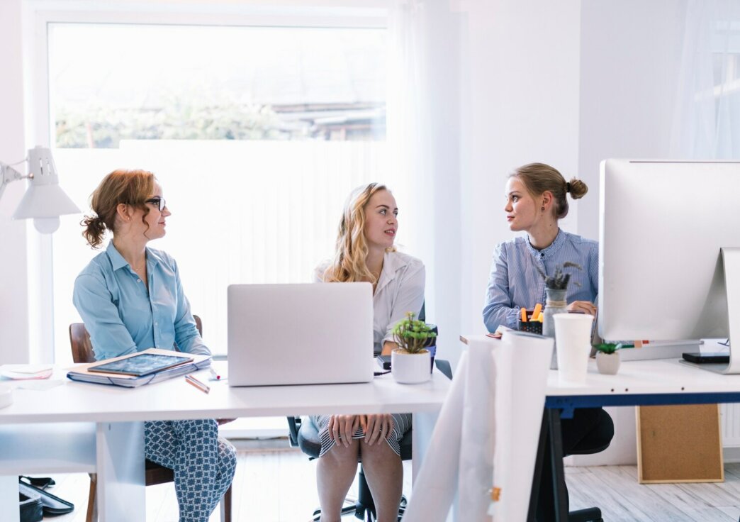 Group of women discussing how to choose the Right White Label WordPress Development Partner