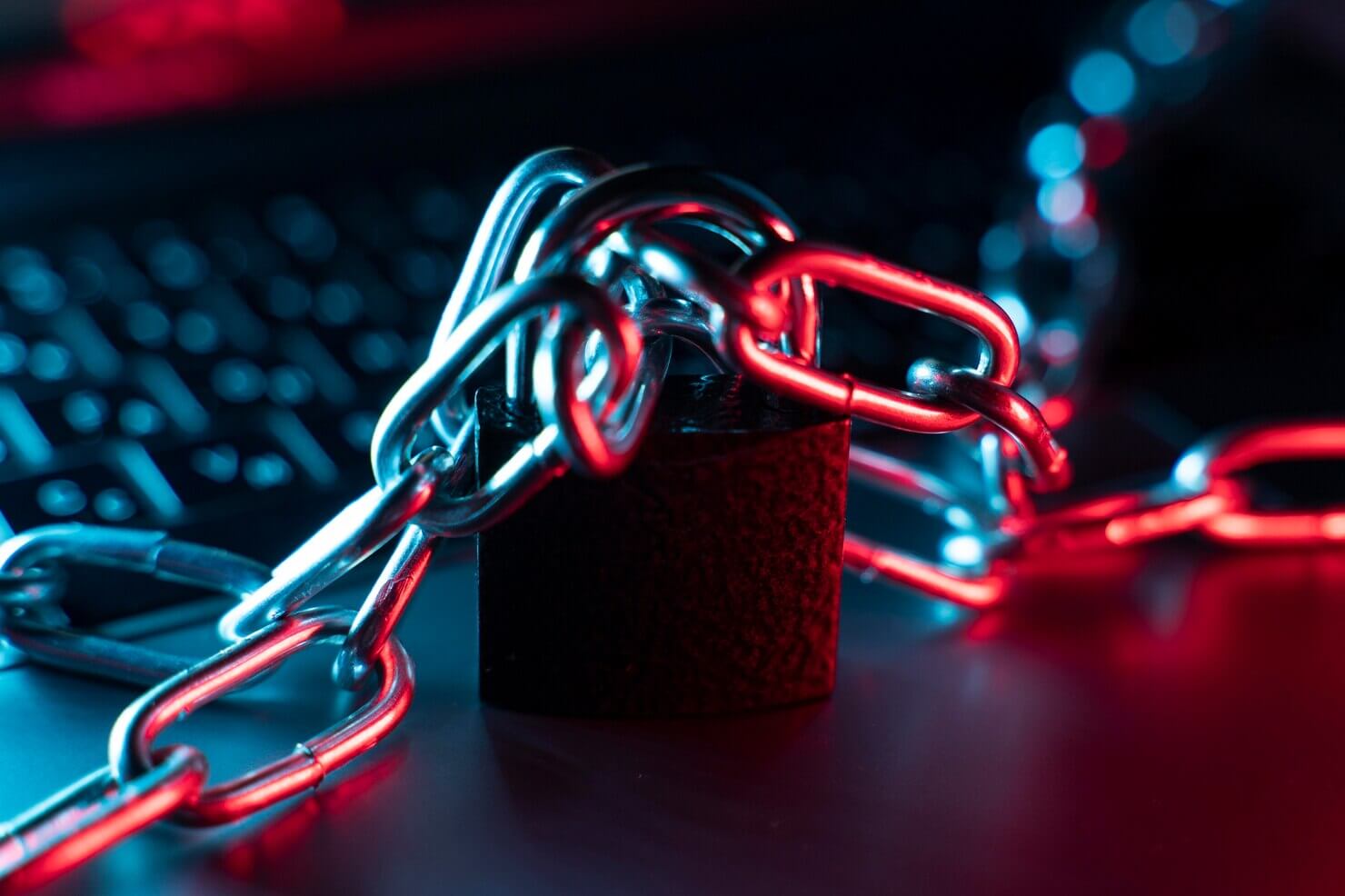 Laptop with lock and chain to represent website security and privacy protection