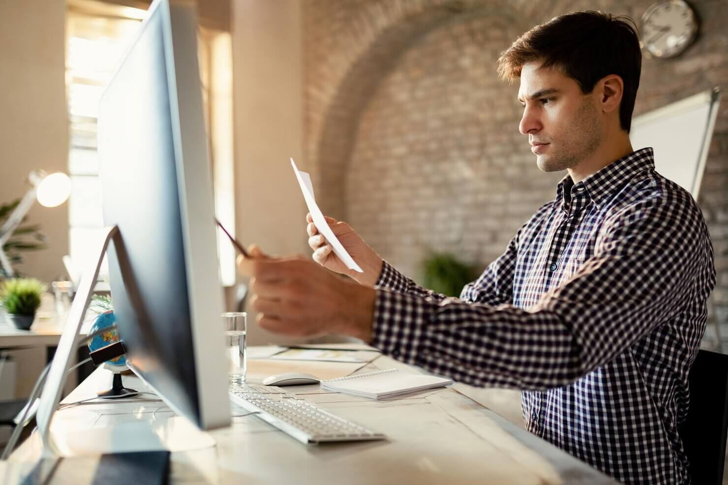 Male developer looking at WordPress support ticket from registered users