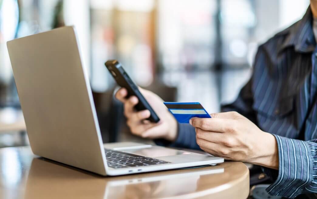 Man doing his online shopping he is choosing from the various types of payment gateways for WooCommerce