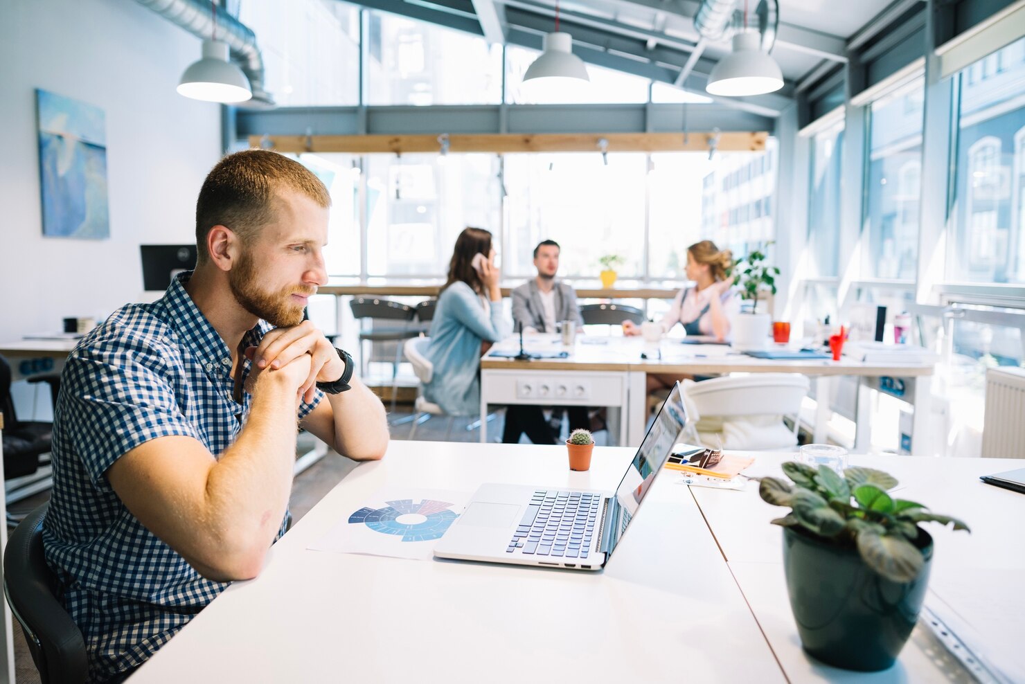 man sitting in an office working on a white-label wordpress project