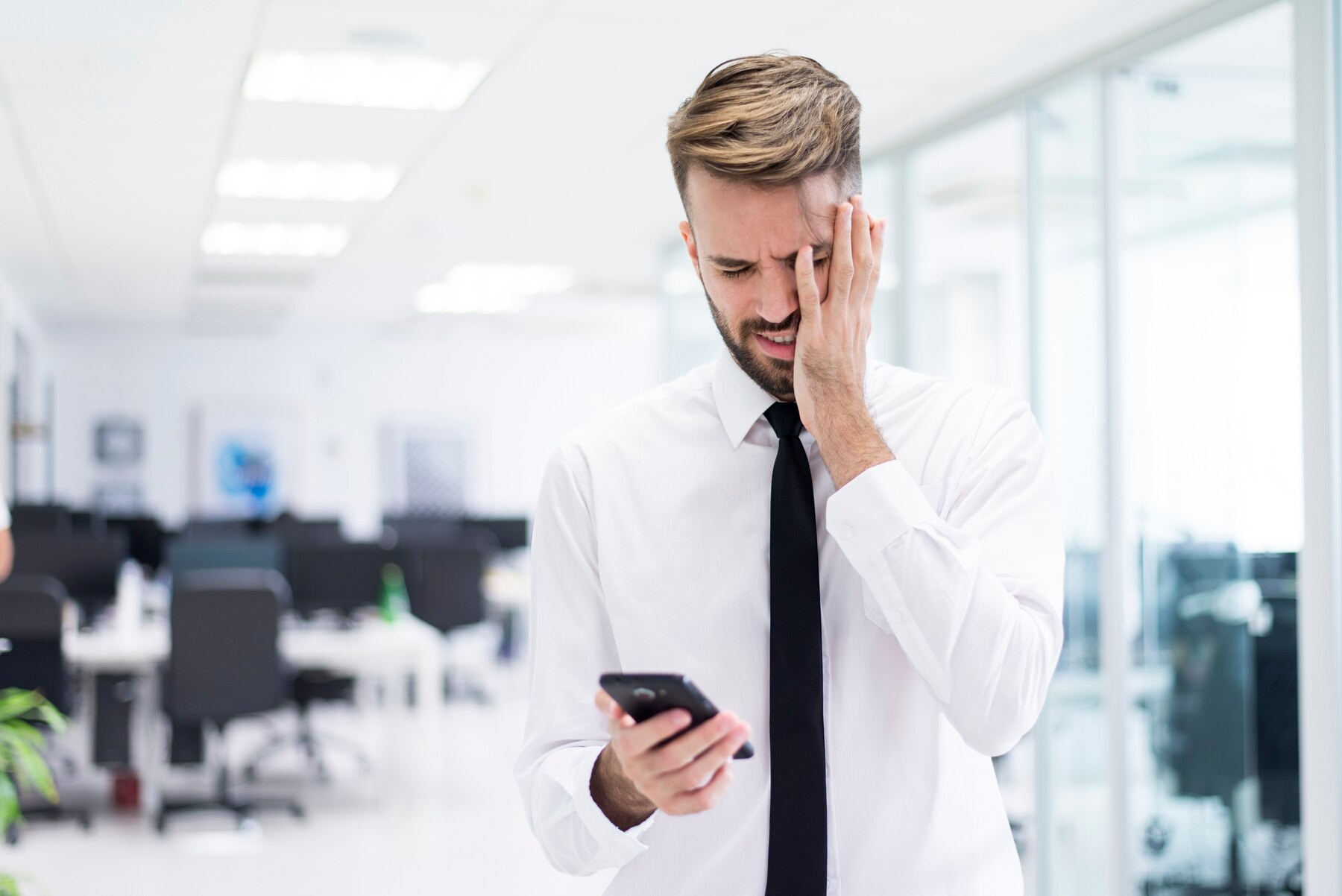 Man with his hand on his face as the outsourcing company he chose, has disappeared.