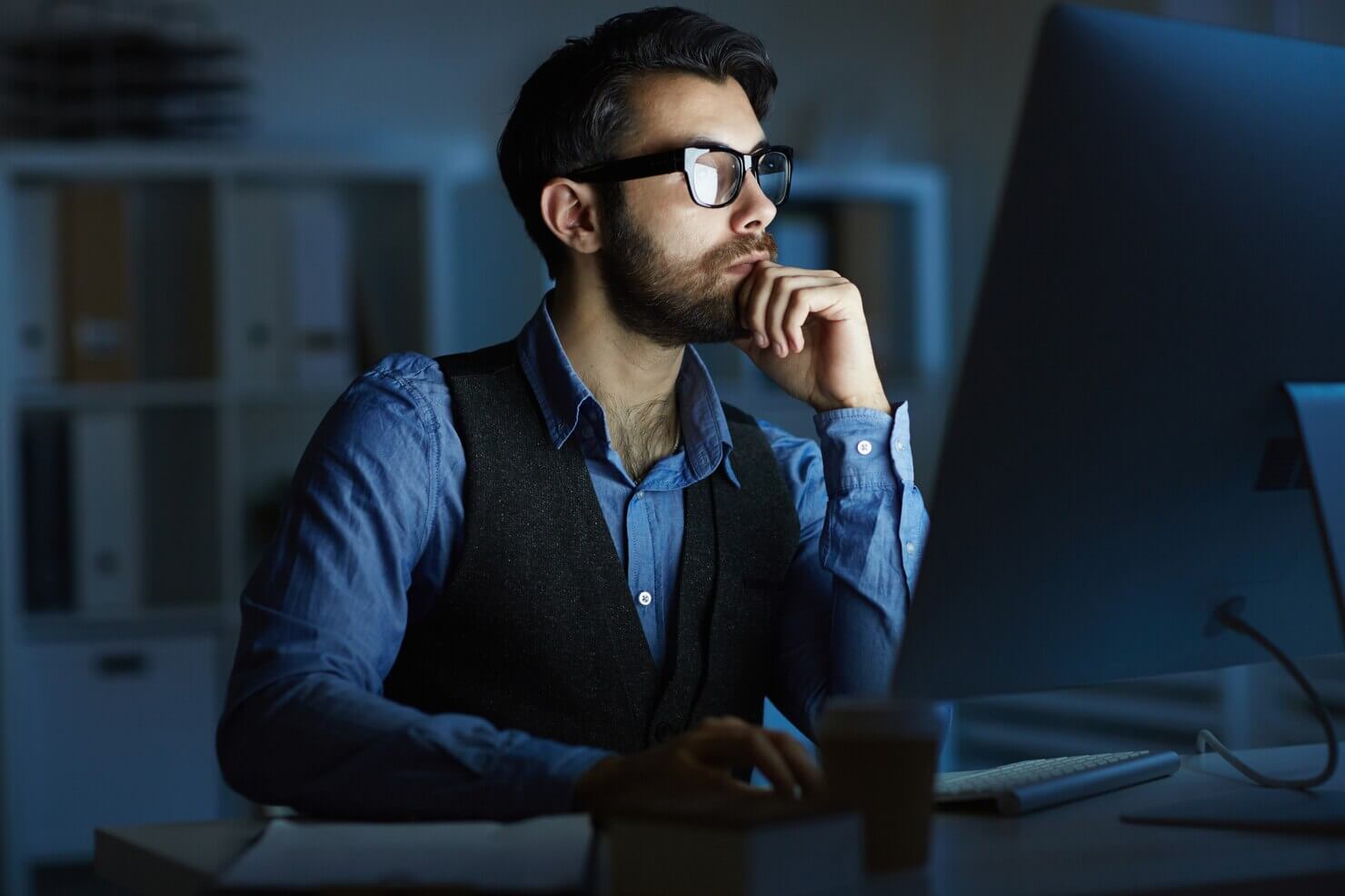 Man working at night to maintain plugins on a WordPress website