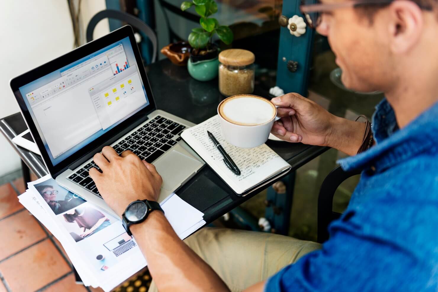 Man Working Coffee Shop Cafe looking at customization options and select themes for WordPress