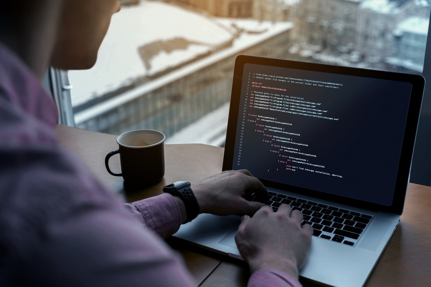 Man working on laptop to create a clutter free website. Attention grabbing is one of the benefits of a one page WordPress website