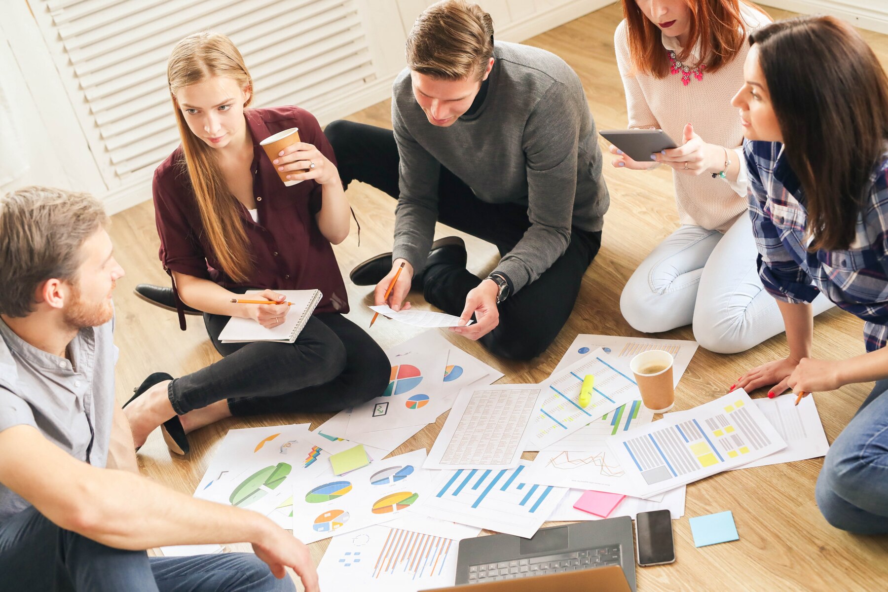 People in the office discussing digital marketing mistakes to avoid with WordPress site