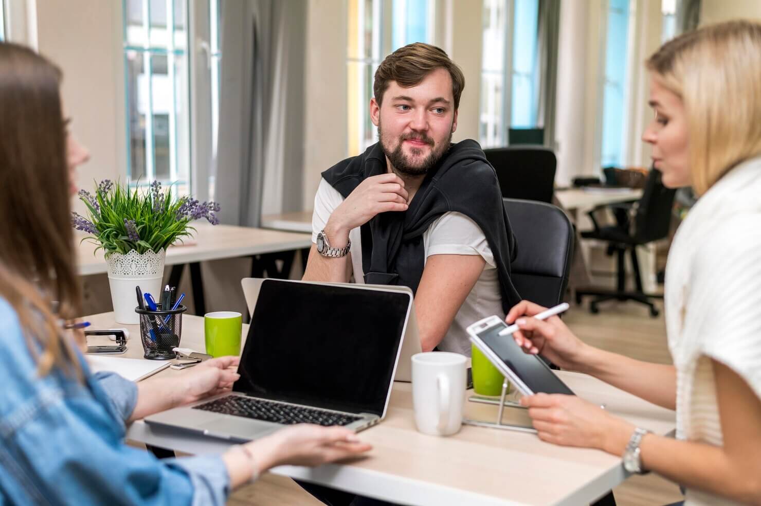 People talking about a work project creating a responsive design with creative content