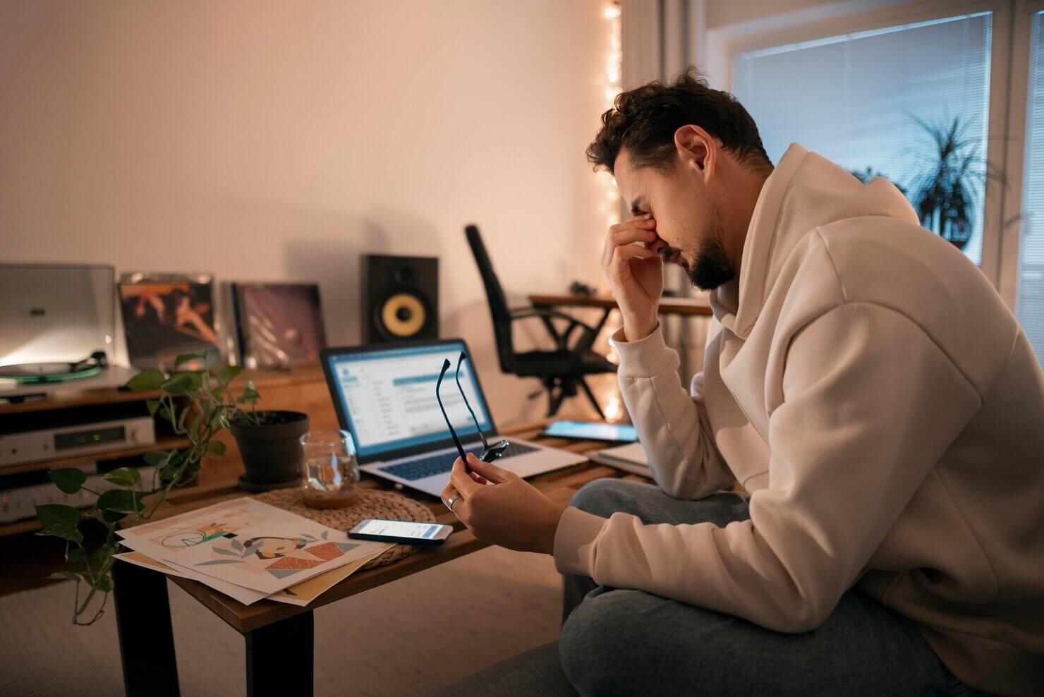 Person at home working late at night. Frustrated with Joomla dashboard and set up process