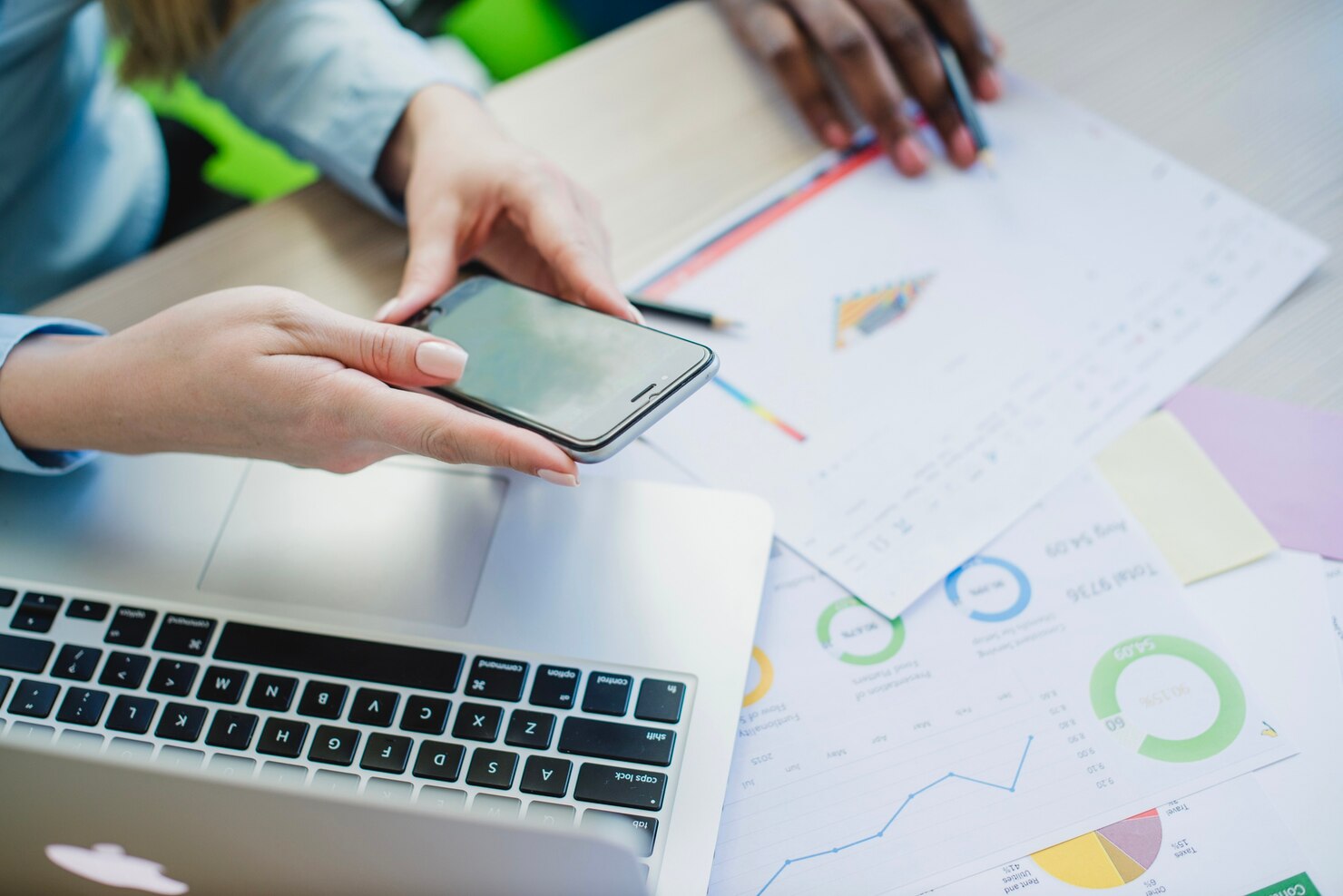 Person in office checking landing page to ensure it's optimized for landing pages
