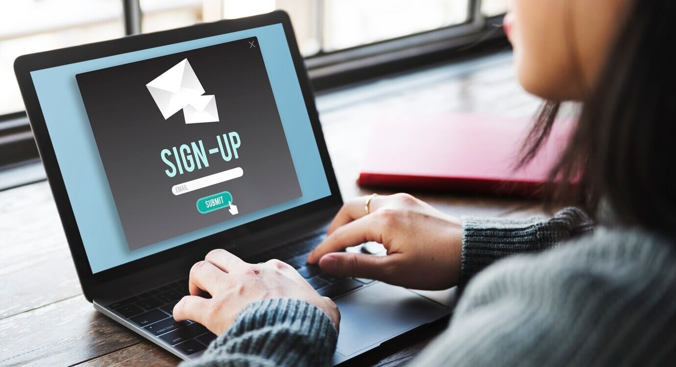 Sign-up with CTA button to submit on website on laptop screen