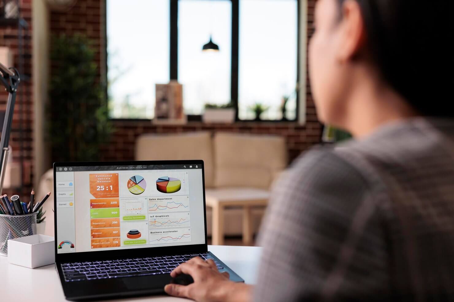 Software developer analyzing charts and graphs about performance and security