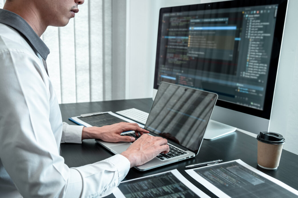 Software developer working on how to manage and organize large WordPress websites