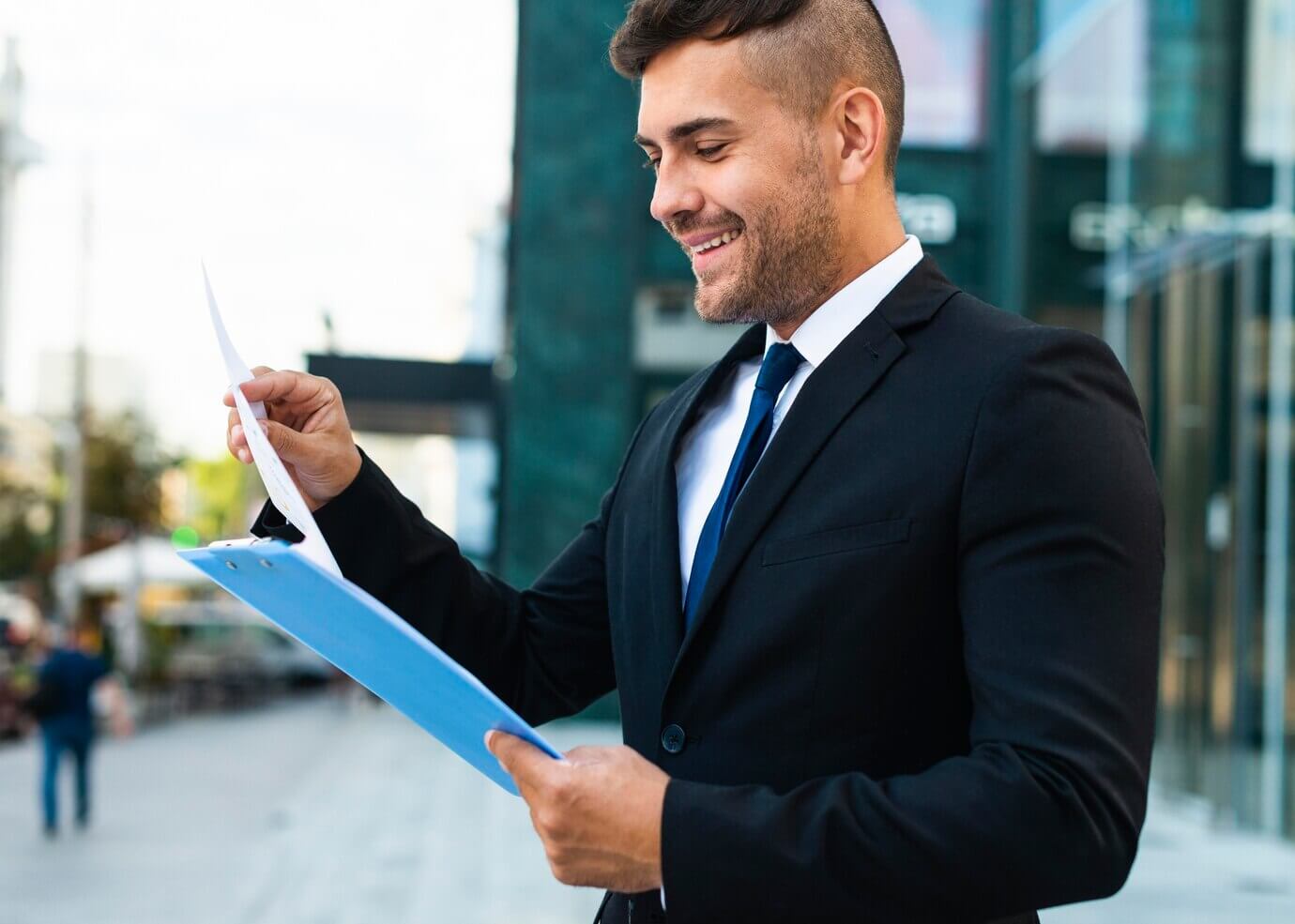 Successful business person working from outdoors. He is creating a checklist for WordPress website audit