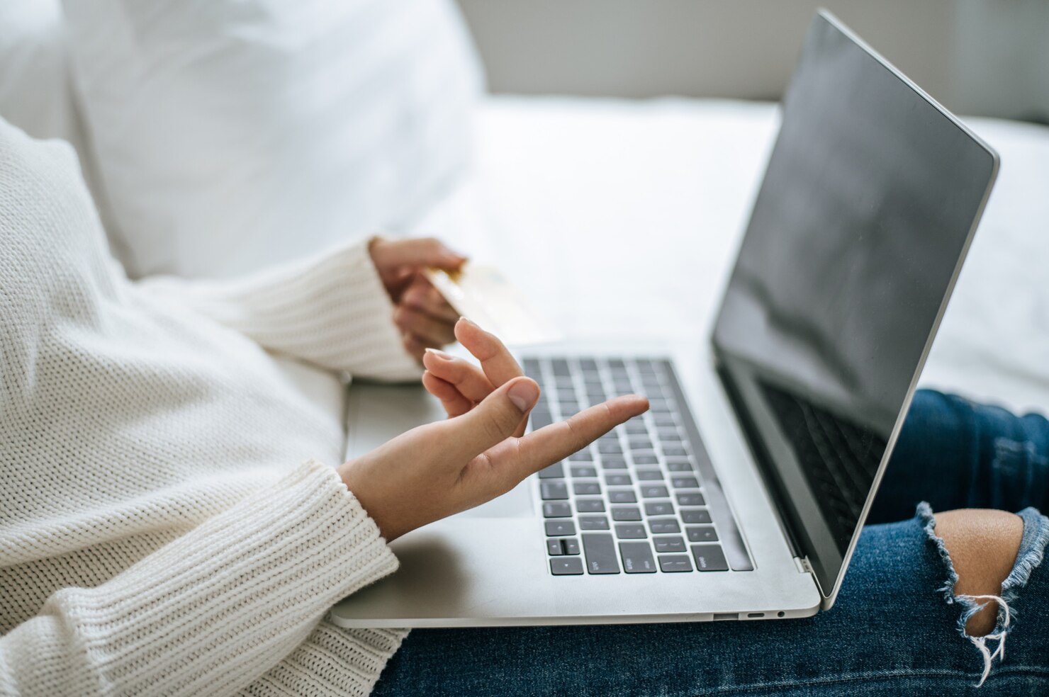 The hand that is put on the laptop. WordPress vs Webflow which easier to use