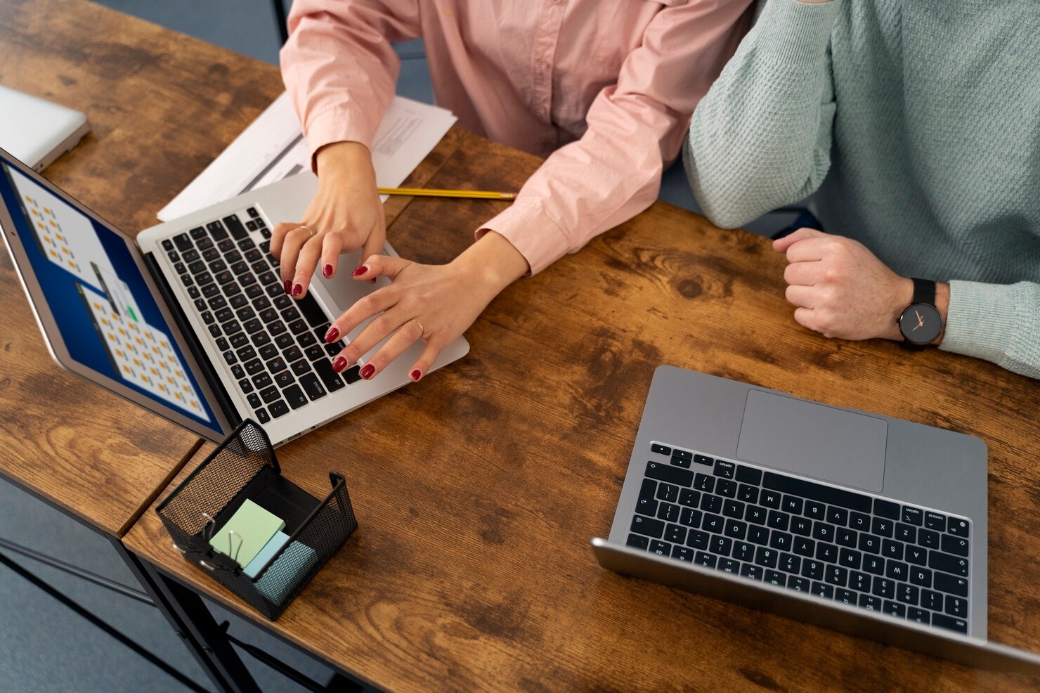 Two people working on their laptops on their websites