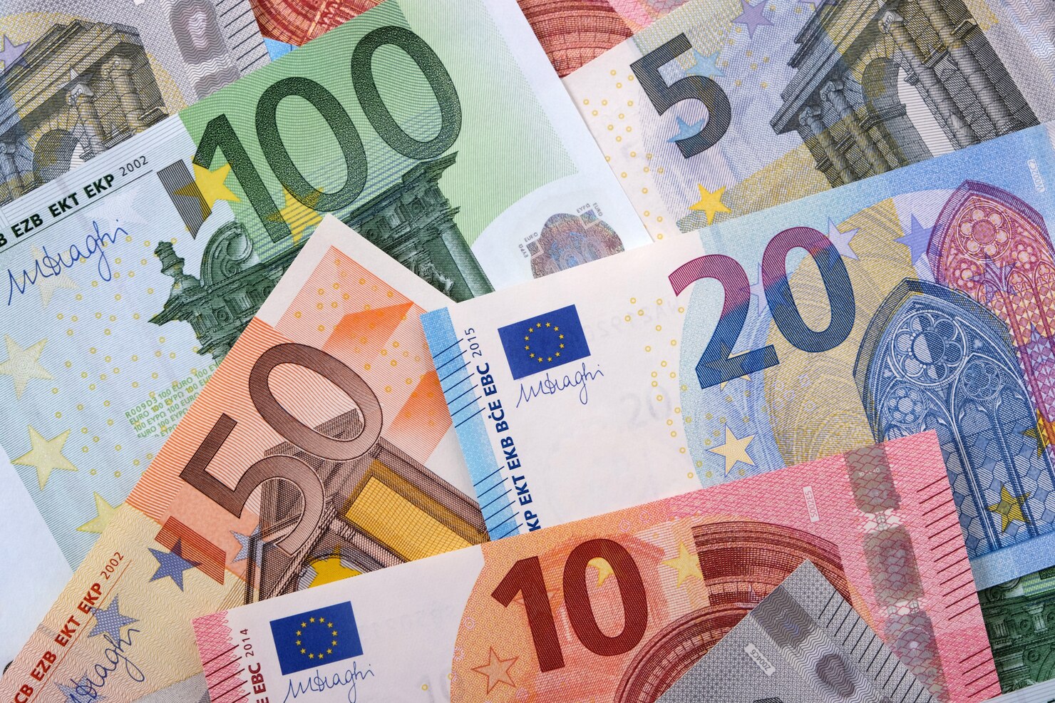 Various different Euros background. Counting the money for new website building platform WordPress vs Squarespace