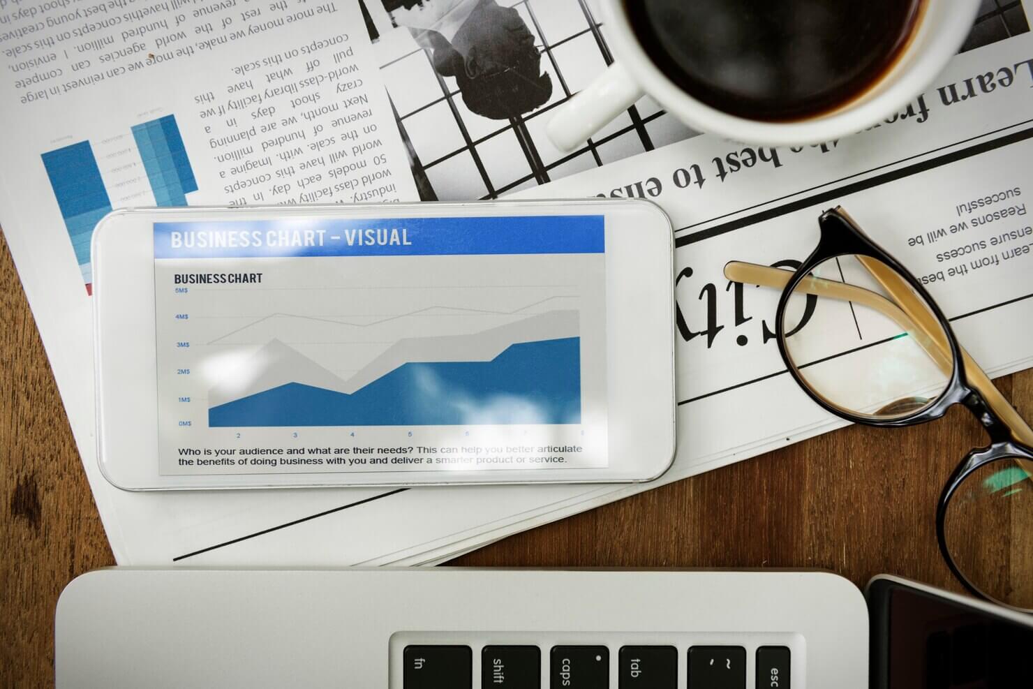 Website on digital device. Chart from online audit tools vs human website audit