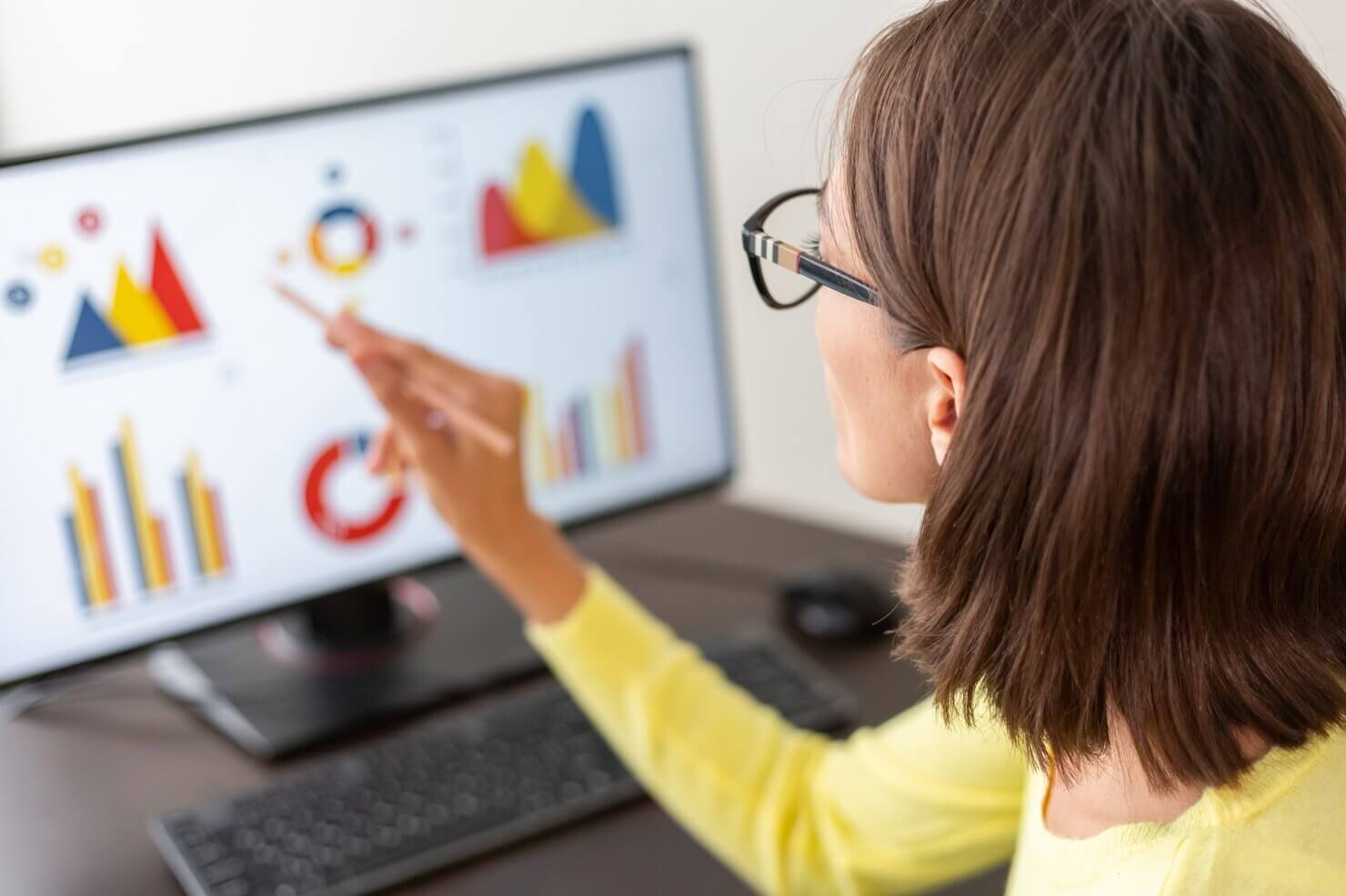 Woman analyzing website and data 