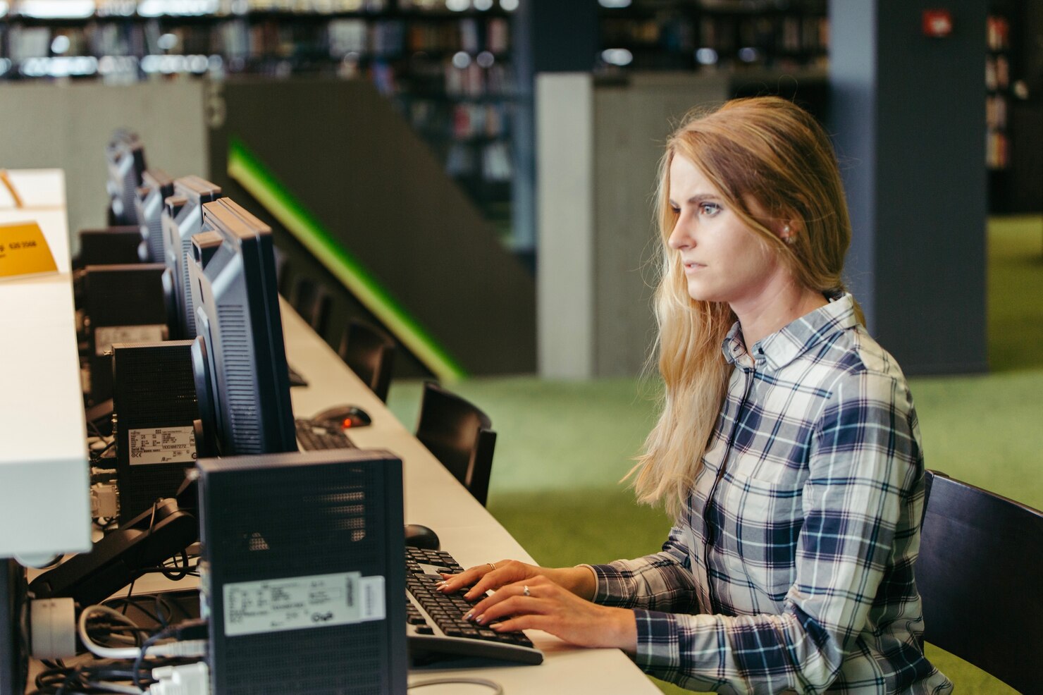 Woman at computer looking into ethical standards in chatbot interactions. Chatbots on user engagement in WordPress websites
