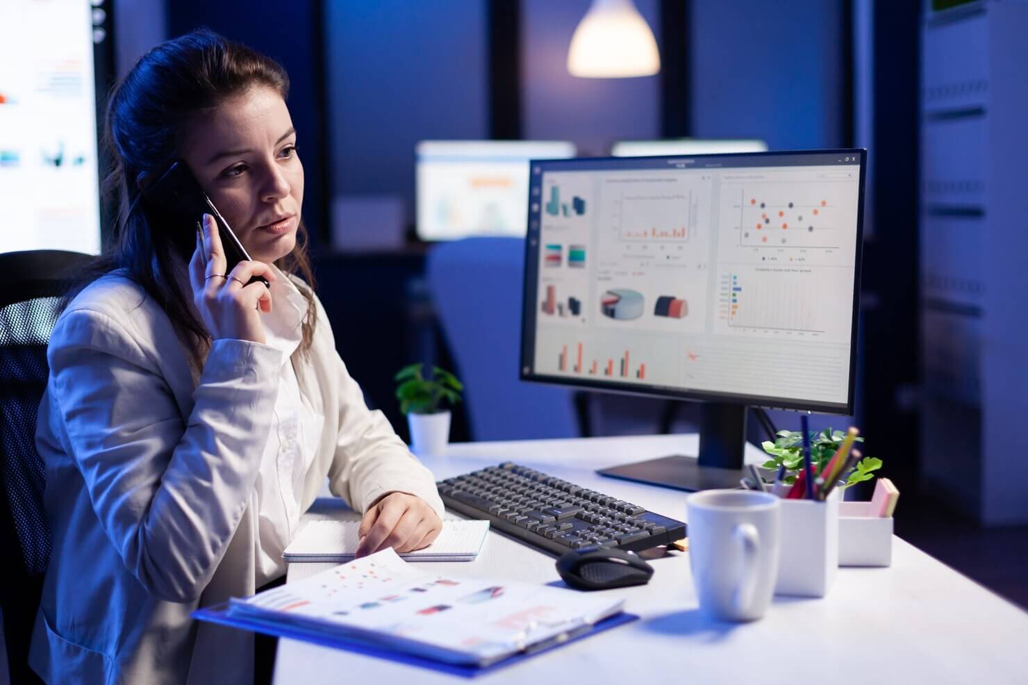 Woman discussing over the phone about when to choose a manual website audit for successful implementation of needed changes
