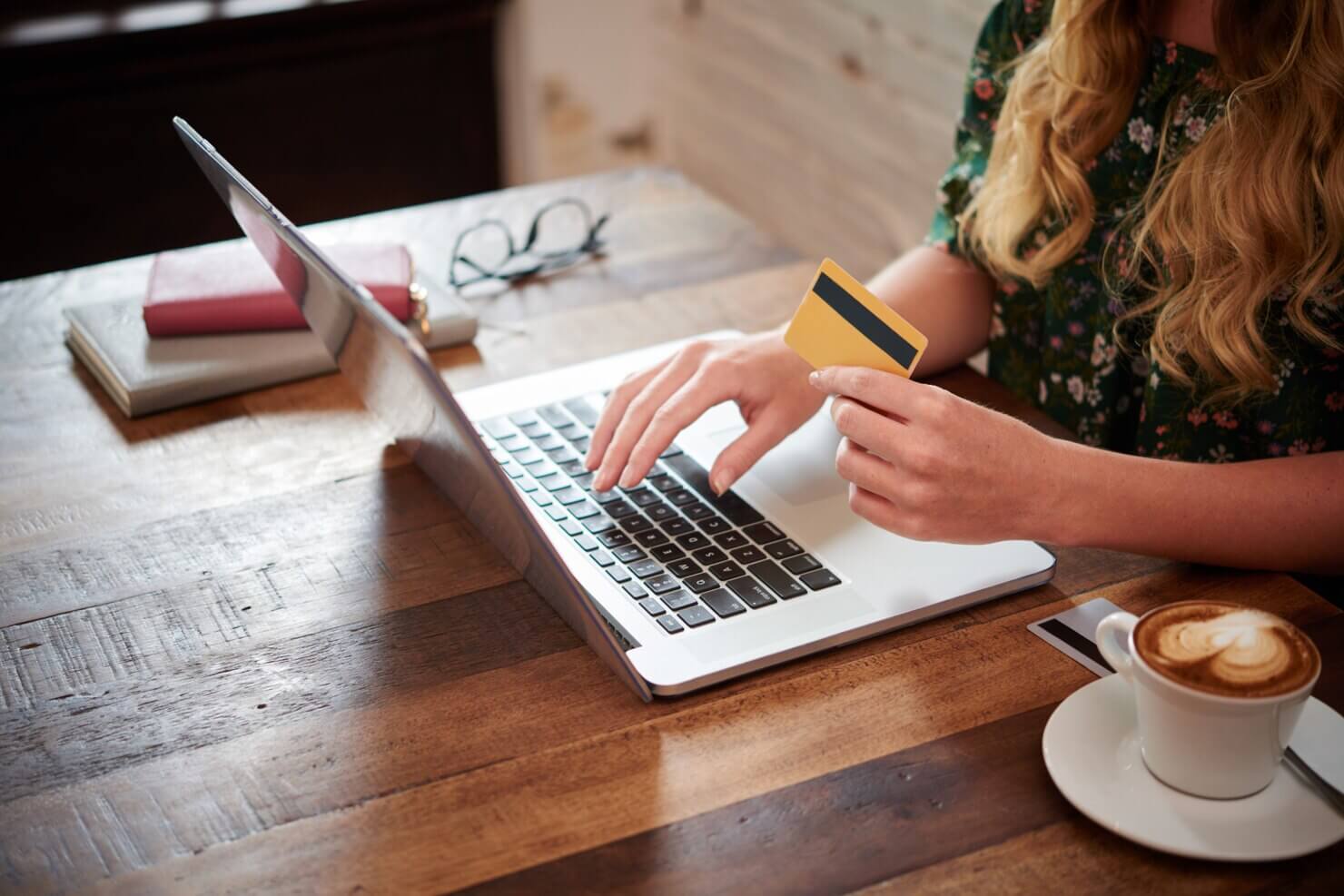 Woman paying for an online order at the cafe