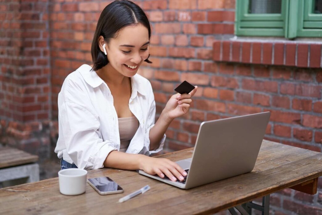 Woman researching on her laptop how to reduce cart abandonment