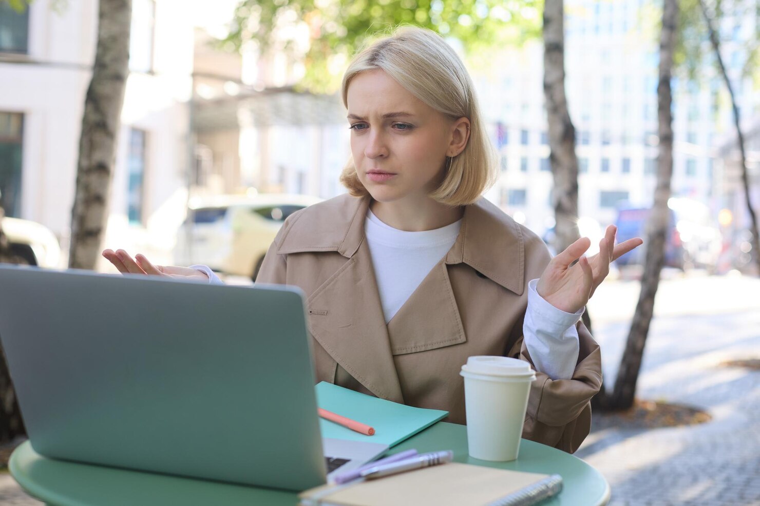 Woman with confused face looking at laptop working remotely, identifying accessibility issues