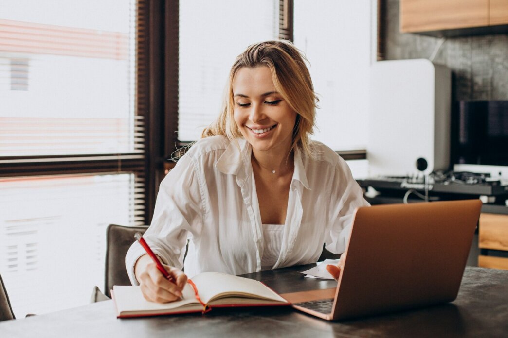 Woman working from home on laptop. She is doing research about a:b testing in WordPress