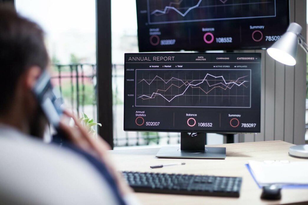 Young business man review WordPress statistics by industry for 2023