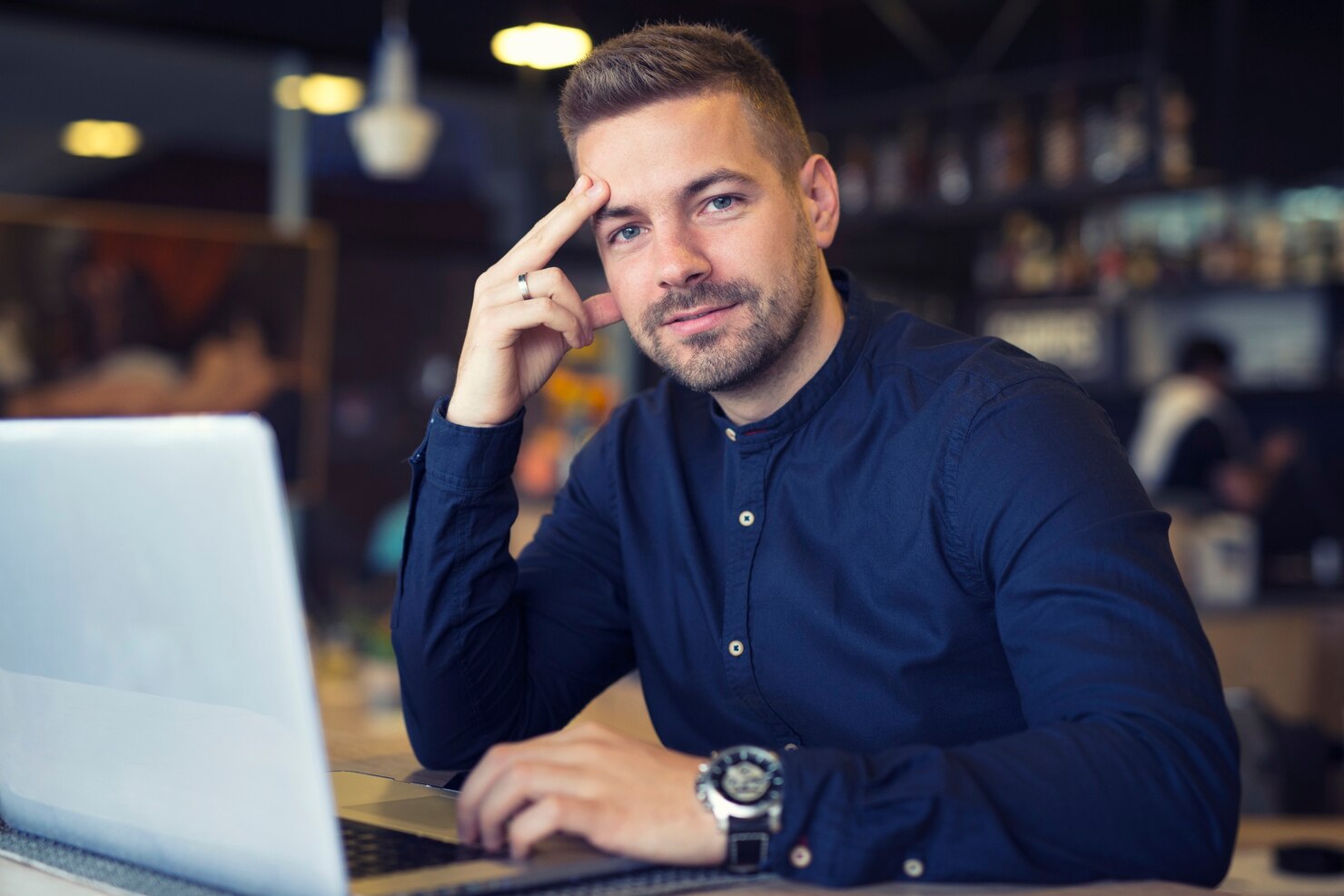 Young businessman researching WordPress website designs mistakes to avoid