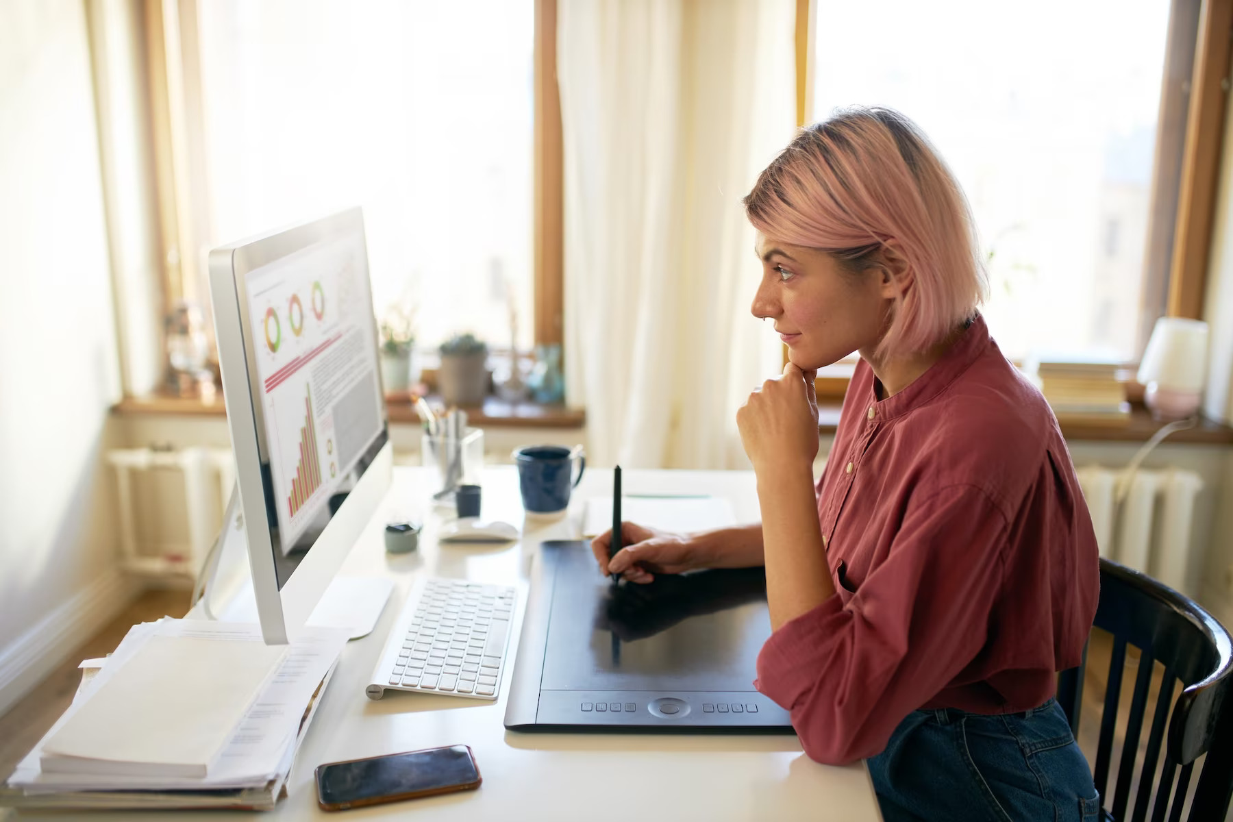 Young female working to post content on website. Inconsistent content updates digital marketing mistakes