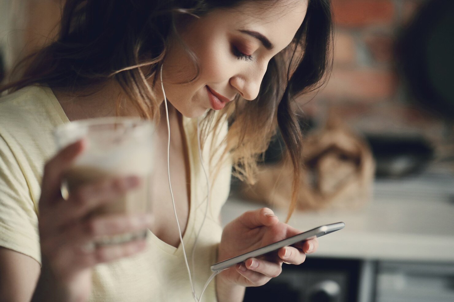 Young woman at home using and testing mobile-friendly website on her device